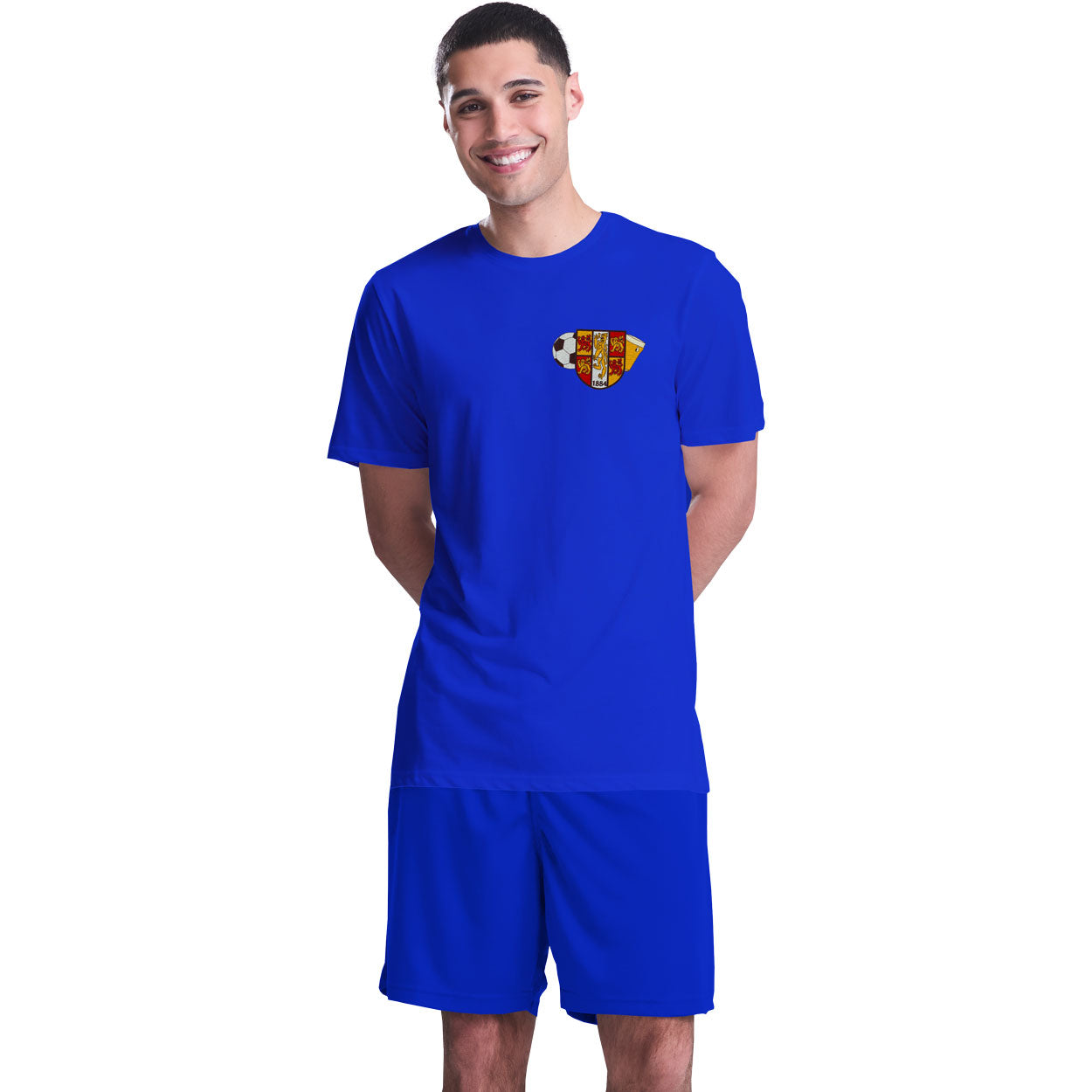 
                  
                    A man modeling a royal blue short sleeve football shirt and matching shorts set. The shirt features a Bangor Old Boys logo on the left breast.
                  
                